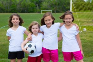 Soccer football kid girls team at sports outdoor fileld before match